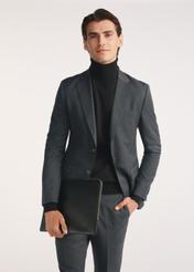 Black men's briefcase TORMS-0474-99(Z25), diagonal view of the product on the model, half of the silhouette visible.