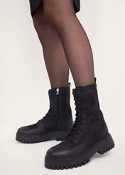 Women's leather ankle boots in combat boot style BUTYD-1004-9I(Z26), side view of the product on the model's feet.