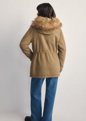 Beige women's fur jacket KURDT-0612-81(Z25) - back view of the product on a model against a white background. Full body visible.