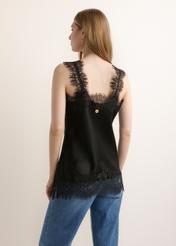 Women's black strappy blouse with lace embellishment BLUDT-0215-99(Z26), product view from the back on the model. Half of the silhouette visible.