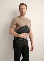 Black men's cosmetic bag TORMN-0425-99(Z26), front view of the product on the model, half of the silhouette visible.