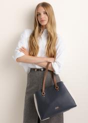 Navy blue women's shopper bag TOREC-1260-7E(Z26), front view of the product on a model. Half of the silhouette visible.