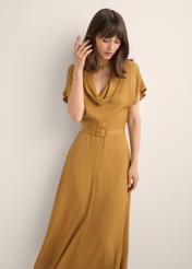 Mustard modal dress SUKDT-0287-2D(Z26), front view of the product on the model. Half of the silhouette visible.