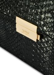 Black women's trunk handbag TOREC-1080-98(Z25), close-up of the product clasp, view on a white background.
