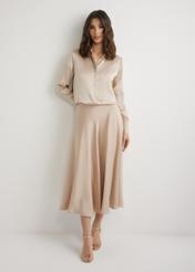 Long beige midi skirt SPCDT-0131-1B(W26), front view of the product on the model. Full body visible.