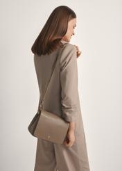 Dark brown leather women's handbag TORES-0911 F-1K(W26), front view of the product on a model, half of the silhouette visible.