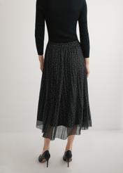 Pleated midi skirt with polka dots SPCDT-0110-9P(W26), product view from the back on the model, half of the silhouette visible.