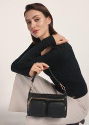 Black leather women's handbag TORES-1161-99(Z25) - front view of the product on a model against a white background. Half of the silhouette visible.