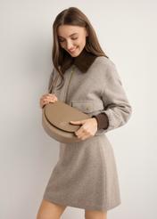 Beige semi-circular women's messenger bag TOREC-1298-1B(Z26), front view of the product on the model. Half of the silhouette visible.