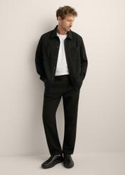 Men's straight-leg knit pants, model SPOMT-0126-99(Z26). Front view of the product on a model. Full silhouette visible.