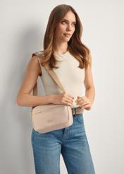 Light pink nylon women's messenger bag TOREN-0309-5A(W26), front view of the product on the model, half of the silhouette visible.