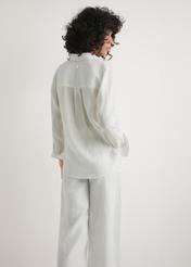 Women's white linen shirt KOSDT-0163A-0B(W26) - back view of the product, on a model, against a light background. Half of the silhouette visible.