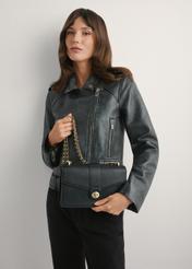 Black women's messenger bag TOREC-1137-99(W26), product view in model's hands. Half of silhouette visible.