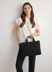 Black cotton women's handbag TOREN-0332-99(W26), product view in model's hand. Half of silhouette visible.