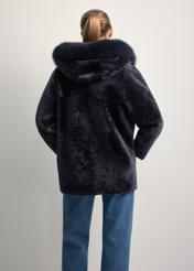 Women's double-sided leather sheepskin coat KOZDS-0094-1397(Z25), back view of the product on the model. Half of the silhouette visible.