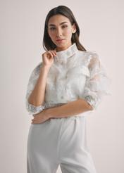 Women's white lace shirt KURDT-0637-0A(W26), front view of the product on the model. Half of the silhouette visible.