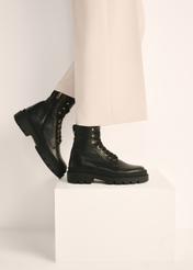 Black leather insulated women's ankle boots BUTYD-1103-99(Z25), product view on the model's feet against a light background.