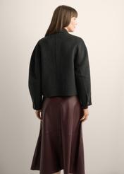 Women's short black wool coat PLADT-0067-99(Z26), back view of the product on the model. Half of the silhouette visible.