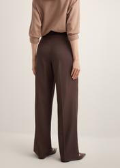 Women's brown trousers SPODT-0112-1I(Z26), product view on the model from the back, half of the silhouette visible.