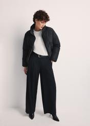 Women's short black jacket KURDT-0601-99(Z25), front view of the product on the model. The entire silhouette is visible.