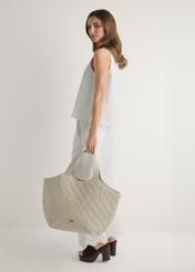 Large quilted leather women's handbag TORES-1306-0B(W26), front view of the product in the model's hand.