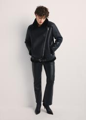 Black short women's sheepskin coat KOZDP-0001A-99(Z24), front view of the product on the model, the entire silhouette is visible.