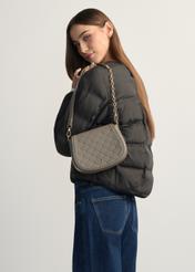 Light brown women's messenger bag TOREC-1179-1K(W26), product view on model's shoulder. Half of silhouette visible.