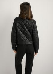 Women's black transitional jacket KURDT-0564A-99(W26), back view of the product on the model. Half of the silhouette visible.