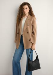 Black medium women's handbag TOREC-1200-99(W26), product view in model's hand. Half of silhouette visible.