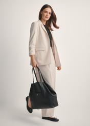 Large black leather shopper bag TORES-1212-9I(W26), diagonal view of the product on the model, the entire silhouette is visible.