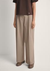 Women's dark beige trousers SPODT-0119-1K(W26), front view of the product on the model. Half of the silhouette visible.