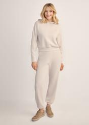 Light beige women's hooded sweatshirt BLZDT-0118-1A(Z26), front view of the product on the model. Full body visible.
