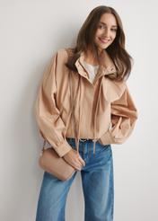 Small pink leather women's handbag TORES-0466E-5D(W26), front view of the product on a model, half of the silhouette visible.