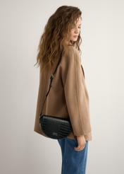 Women's black semi-circular croco messenger bag TOREC-1184-9G(W26), product view on model's shoulder. Half silhouette visible.