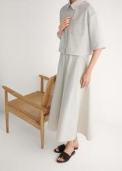 Women's suede slides in dark brown BUTYD-1255-1I(W26), side view of the product on the model's feet.