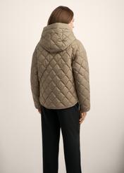 Women's quilted jacket in cool beige KURDT-0588-1K(Z26), back view of the product on the model. Half of the silhouette visible.
