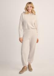 Light beige women's hooded sweatshirt BLZDT-0118-80(Z25), front view of the product on the model. Full body visible.