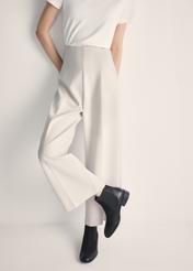 Black leather women's shoes BUTYD-0936A-98(Z25), product view on model's feet against a light background.