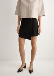 Women's black culottes SZODT-0008-99(W26), front view of the product on the model. Half of the silhouette visible.