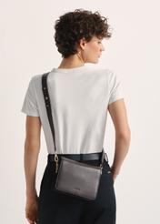 Women's brown leather handbag TORES-1138A-89(Z25), front view of the product on the model, half of the silhouette visible.