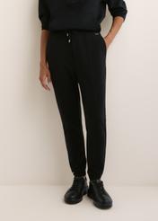 Women's black trousers SPODT-0108-99(W26), front view of the product on the model. Half of the silhouette visible.