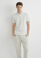 White polo shirt POLMT-0090-0B(W26), front view of the product on the model. Half of the silhouette visible.