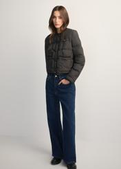 Black women's short jacket KURDT-0621-99(W26), front view of the product on the model. Full body visible.