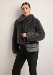 Small black shoulder bag TOREC-1244-99(Z26), front view on model. Half of silhouette visible.