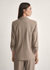 Women's dark beige jacket ZAKDT-0043-1K(W26), product view from the back on the model, half of the silhouette visible.