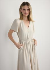 Women's light beige dress SUKDT-0255-1A(W26), front view of the product on the model. Half of the silhouette visible.
