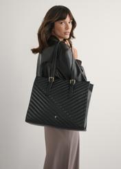 Large black leather women's handbag TORES-1287-99(W26), front view of the product on a model, half of the silhouette visible.