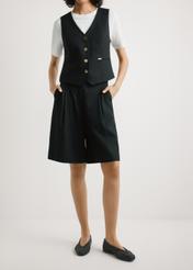 Women's elegant black shorts SZODT-0017-99(W26), front view of the product on the model. Half of the silhouette visible.