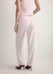 Light pink elegant women's trousers SPODT-0106A-5A(W26), product view from the back on the model, half of the silhouette visible.