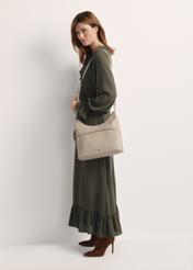 Cream handbag with purse TOREC-0886A-80(Z25), front view of the product on a model, the whole silhouette is visible.